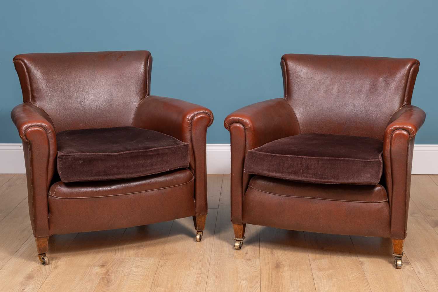 Lot 323 - A pair of leatherette upholstered library tub chairs