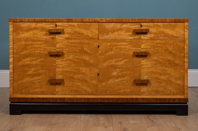 Lot 489 - A 20th century Continental maple ebonised low chest of drawers in the Art Deco style