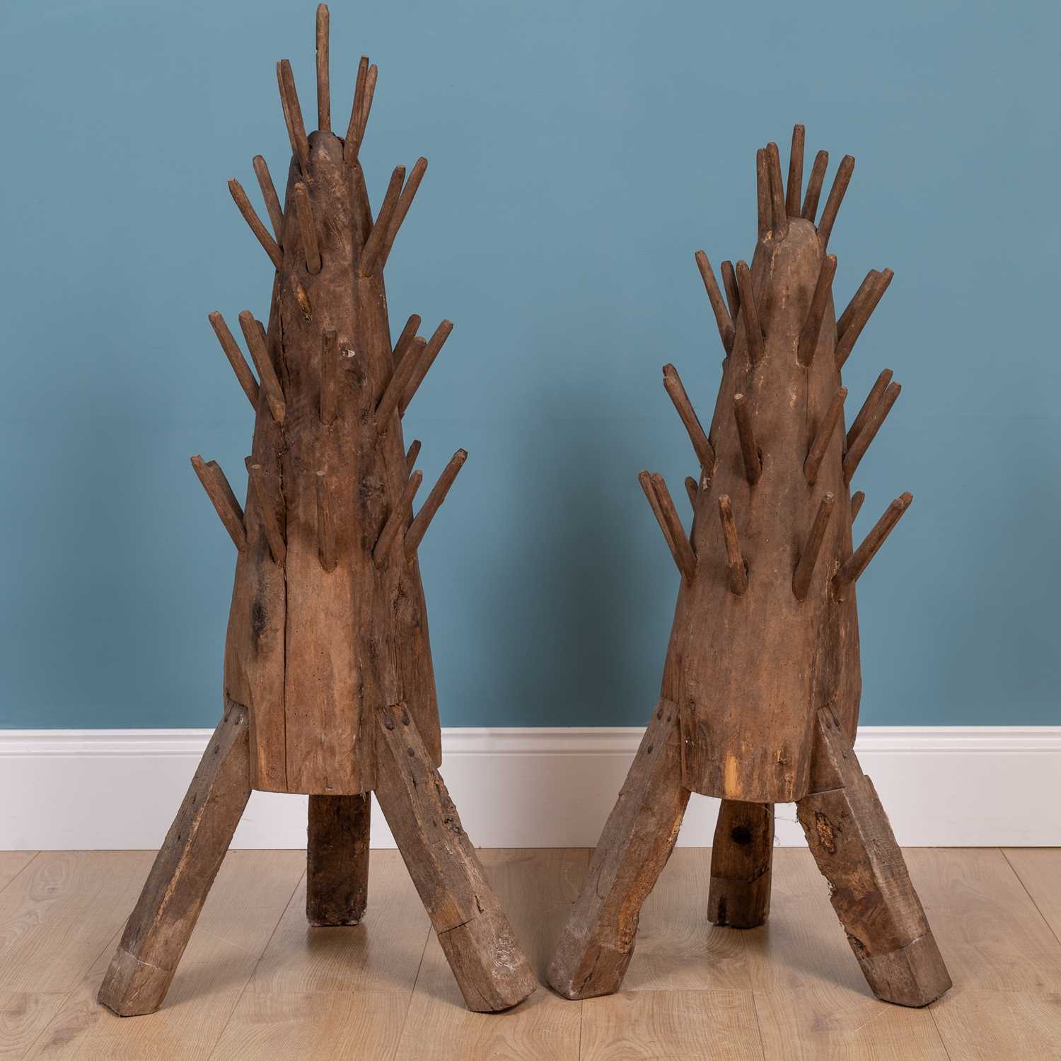 Lot 162 - Two similar French hérisson (hedgehog) wood wine bottle dryer racks