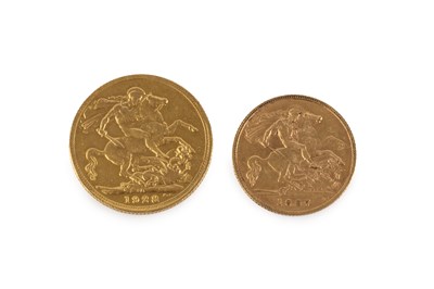 Lot 94 - A George V sovereign, dated 1928, and an...