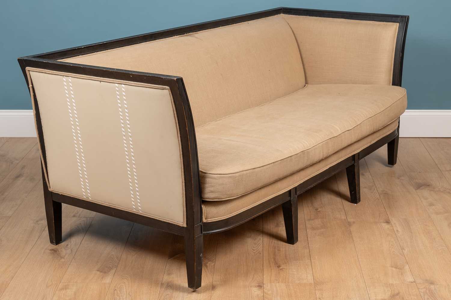 Lot 43 - A contemporary French style dark stained beechwood sofa