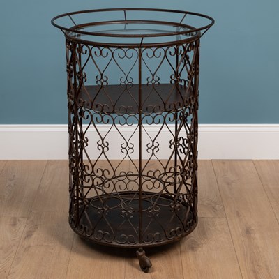 Lot 274 - A circular brown painted wrought iron drinks trolley
