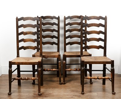 Lot 168 - Set of four stained beech ladder back dining...