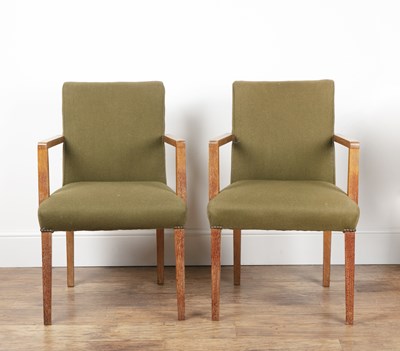 Lot 101 - Pair of Heals elbow chairs Limed oak frame,...