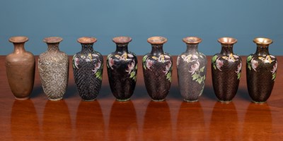 Lot 29 - A cased set of eight vases to demonstrate the process of cloisonné manufacture