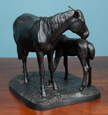 Lot 100 - Russian School, a cast iron sculpture depicting a mare and its foal