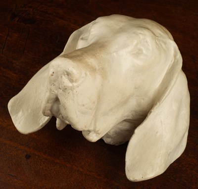Lot 44 - A cast plaster wall mounted dogs head