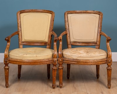 Lot 216 - A pair of continental chestnut armchairs