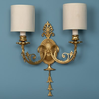 Lot 144 - An Italian gilt brass six-light chandelier; together with two pairs of twin-light wall sconces