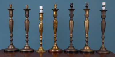 Lot 209 - A pair of tall brass table lamps; together with five further very similar table lamps