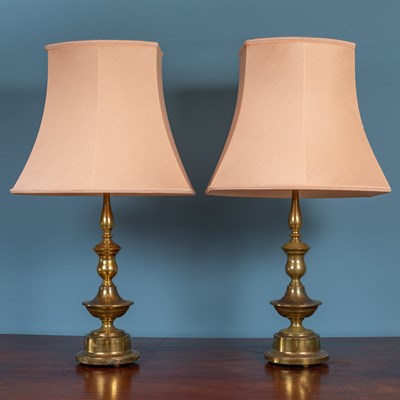 Lot 555 - A pair of brass table lamps