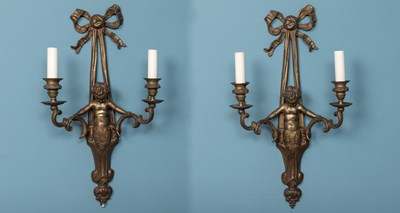 Lot 545 - A pair of Louis XVI style bronzed metal, twin-branched wall sconces