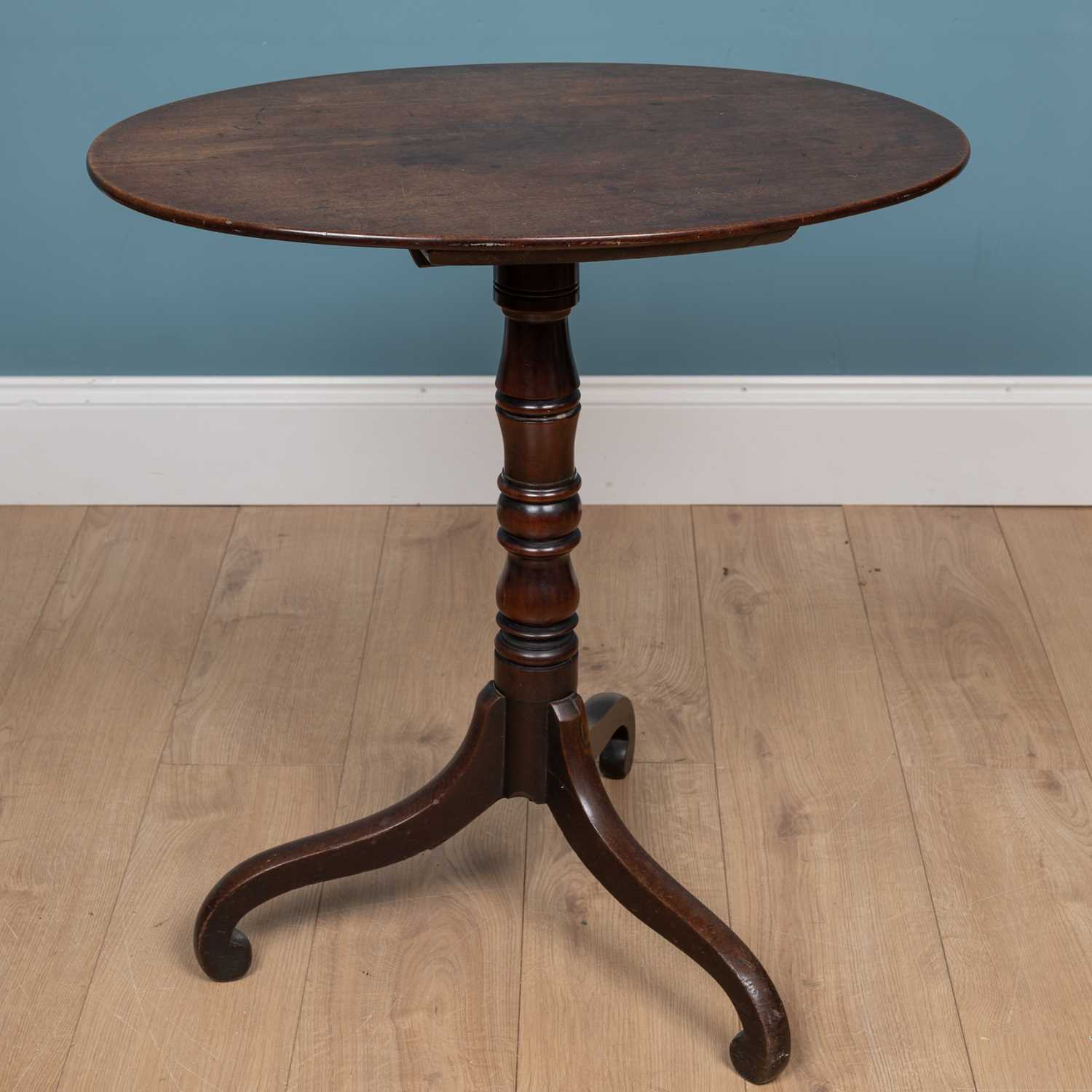 Lot 167 - A Georgian mahogany tilt top oval tripod table