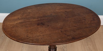 Lot 167 - A Georgian mahogany tilt top oval tripod table