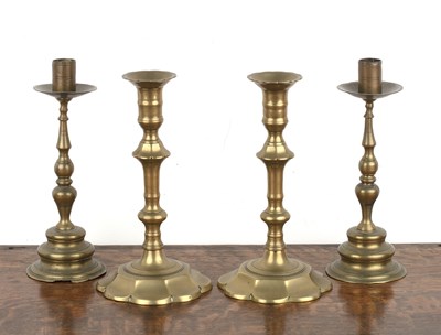 Lot 413 - Two pairs of Continental brass candlesticks...
