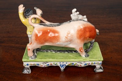 Lot 402 - An early 19th century Staffordshire bull baiting group