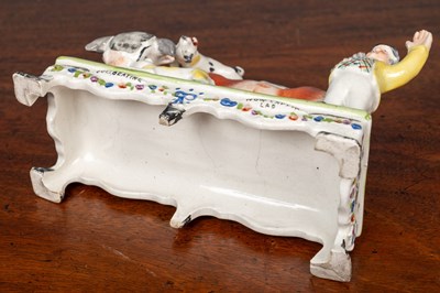 Lot 402 - An early 19th century Staffordshire bull baiting group