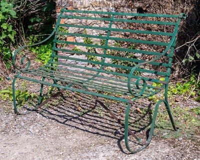 Lot 1270 - A green painted wrought iron garden bench