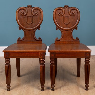 Lot 162 - A pair of 19th century oak hall chairs