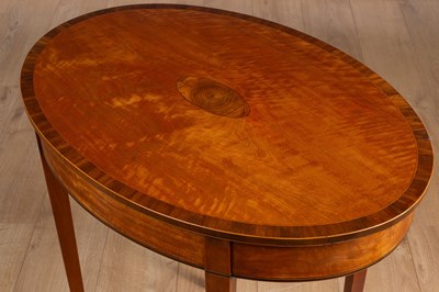 Lot 487 - An antique satinwood oval lamp table