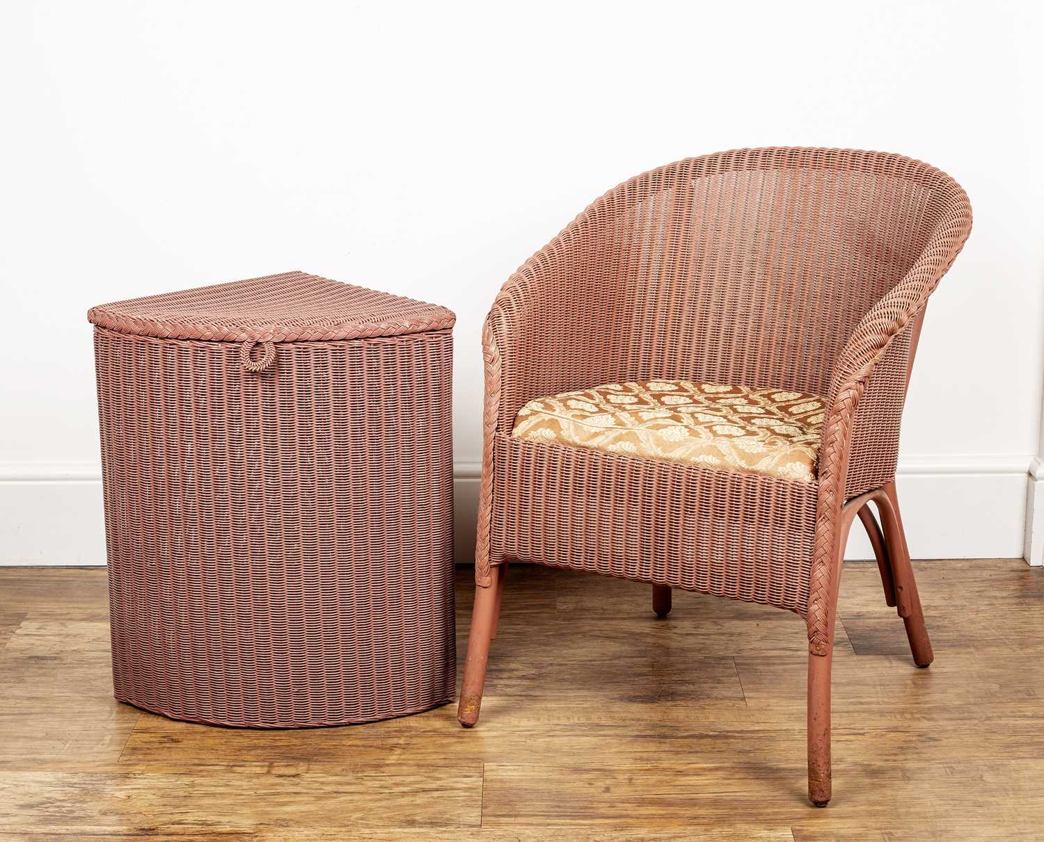 Lot 67 - Lloyd Loom pink wicker armchair, with drop in...