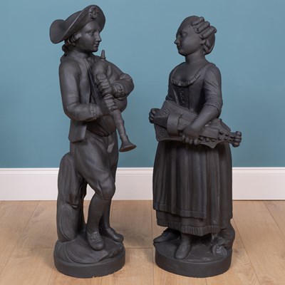 Lot 1323 - A pair of painted plaster figures of a boy and a girl in the manner of John Cheere