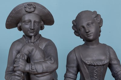 Lot 1323 - A pair of painted plaster figures of a boy and a girl in the manner of John Cheere