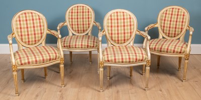 Lot 307 - A set of four 18th century French style cream painted painted and parcel gilt open armchairs