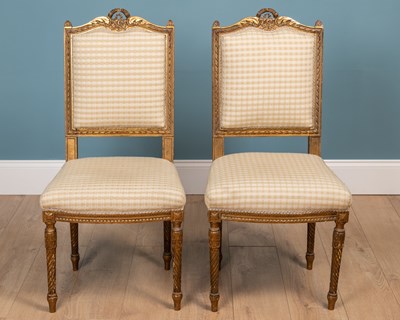 Lot 559 - A pair of French gilt carved wood side chairs