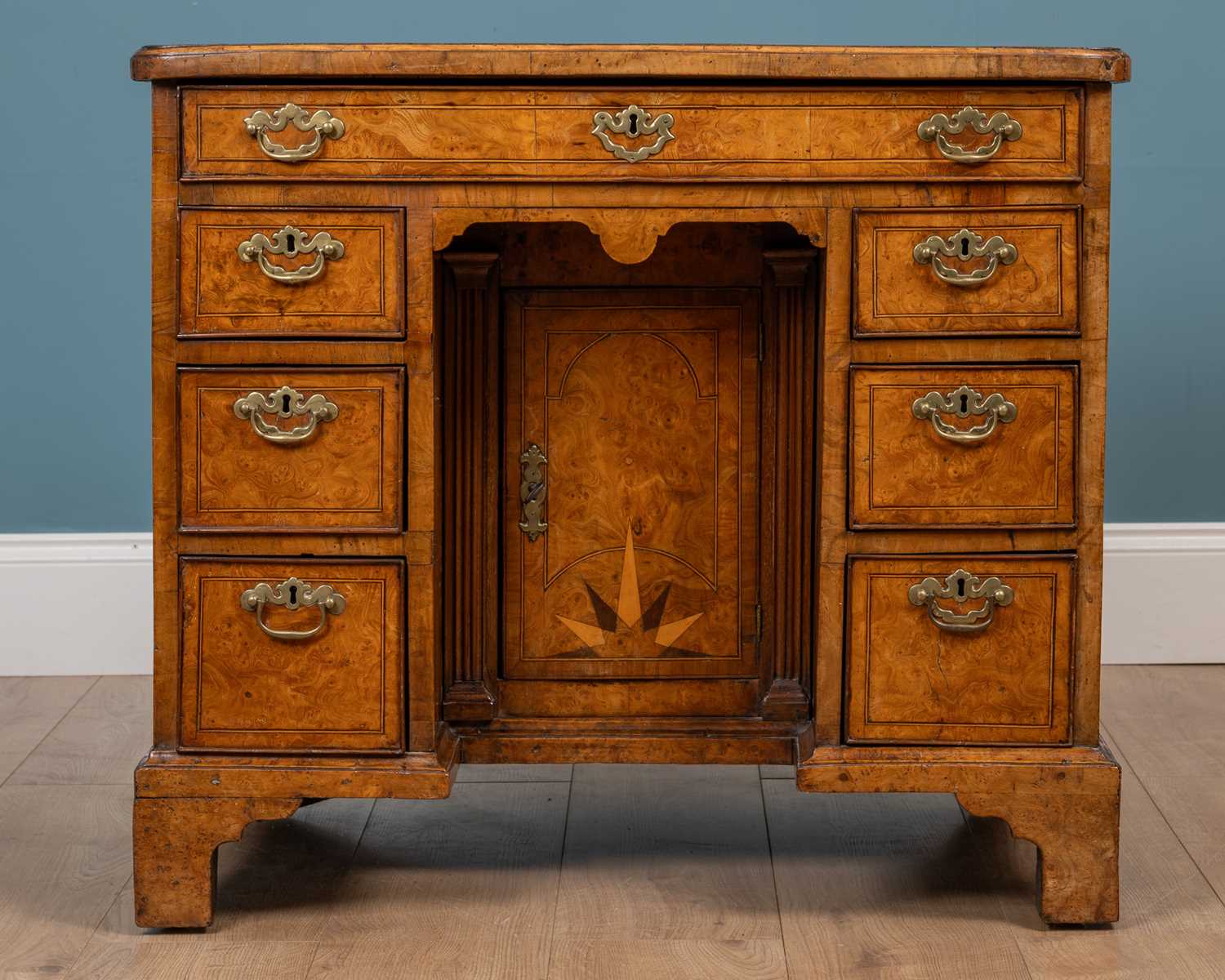 Lot 470 - A George I burr elm knee hole desk