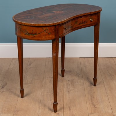Lot 143 - An Edwardian satinwood kidney shaped occasional table