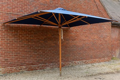 Lot 1274 - A large blue parasol by the Colonial Company