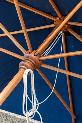 Lot 1274 - A large blue parasol by the Colonial Company