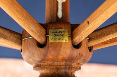 Lot 1274 - A large blue parasol by the Colonial Company