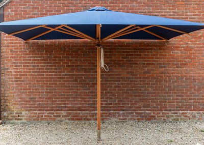 Lot 1274 - A large blue parasol by the Colonial Company