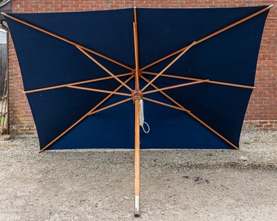 Lot 1274 - A large blue parasol by the Colonial Company