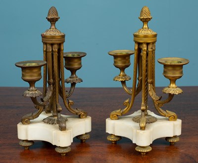 Lot 35 - A pair of antique French gilt metal two-branch candelabra