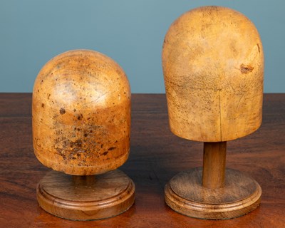 Lot 354 - Two carved wooden hat blocks