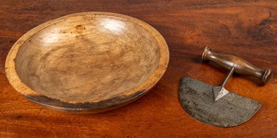 Lot 423 - An antique turned sycamore kitchen bowl