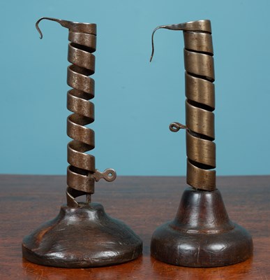 Lot 445 - Two similar Continental spiralling pigtail type candlesticks