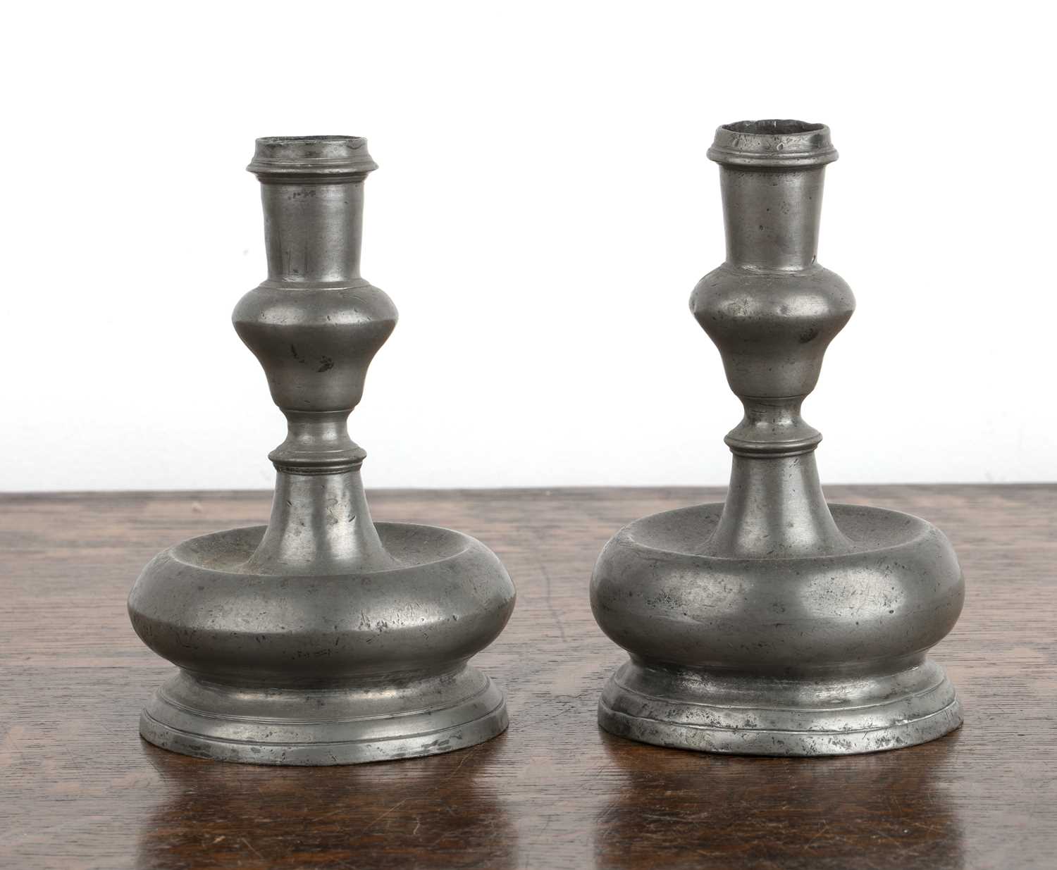 Lot 402 - Pair of acorn knop pewter candlesticks 18th...