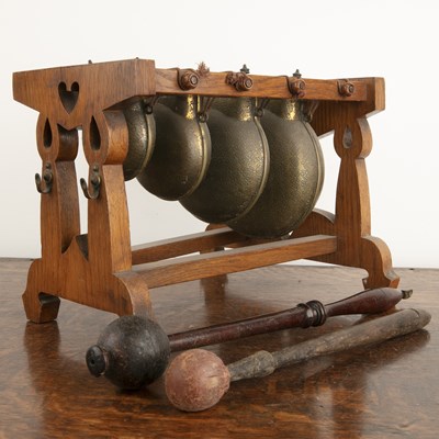 Lot 391 - Oak stand with bells circa 1930, 32cm long x...