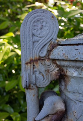 Lot 1357 - A Victorian cast iron urn and cover on a stepped plinth base after the Sosibios vase