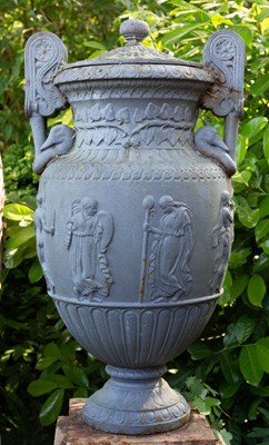 Lot 1357 - A Victorian cast iron urn and cover on a stepped plinth base after the Sosibios vase
