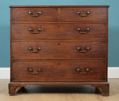 Lot 372 - A George III mahogany chest of two short over three long drawers