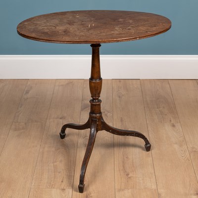 Lot 518 - A George III oval tripod table