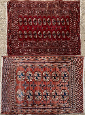 Lot 1067 - A Baluchi style red ground rug; together with a further similar slightly larger rug