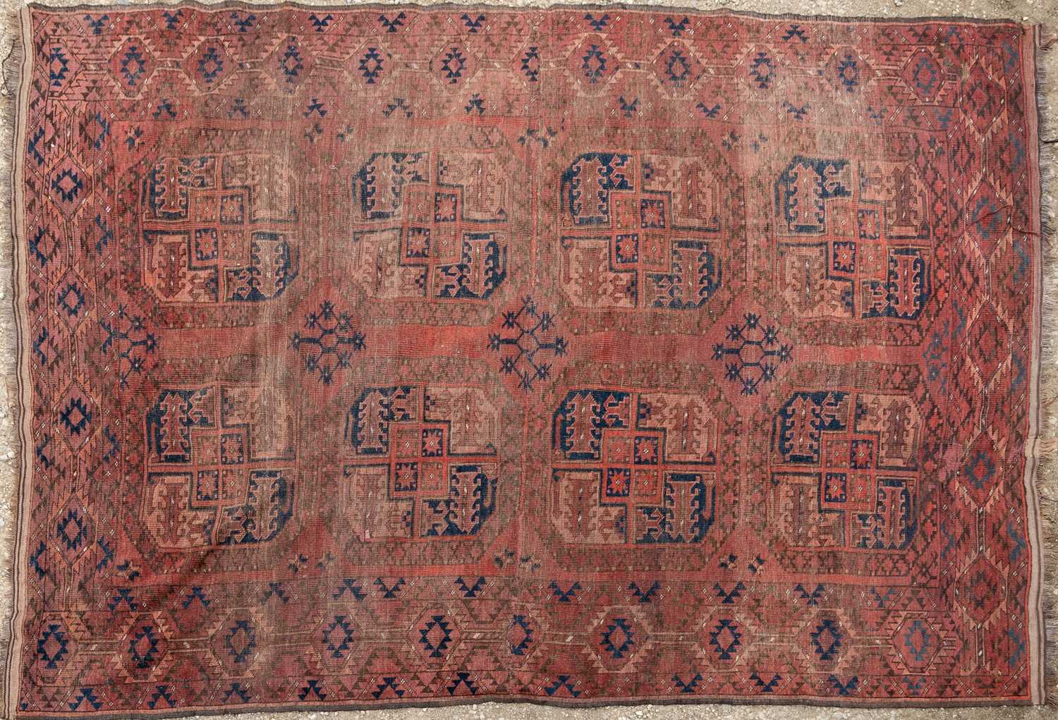 Lot 1061 - A red ground Oriental large rug