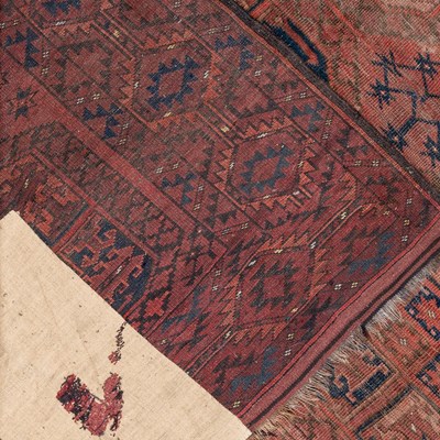 Lot 1061 - A red ground Oriental large rug