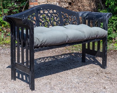 Lot 215 - A black painted cast aluminium garden bench